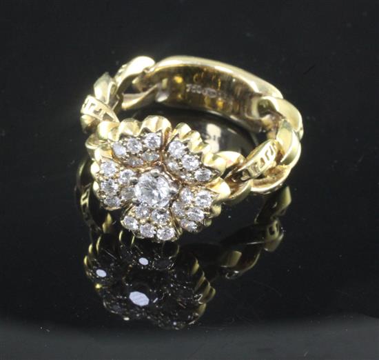 A Gianni Versace 18ct gold and diamond set flowerhead ring, size Q.